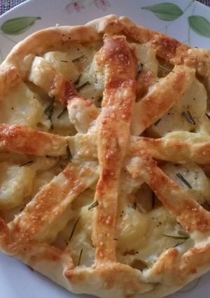 A picture of Rustic potato, rosemary and Parmesan pie.