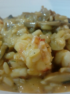Una foto de Risotto langostinos y champiñones