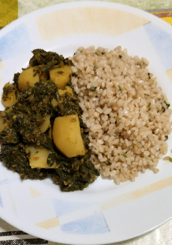Una foto de Saag Aloo. Patatas con espinacas