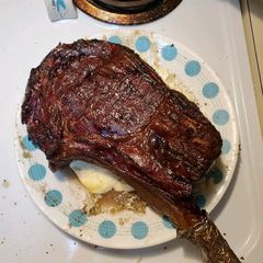 A picture of Smoked Tomahawk Ribeye.