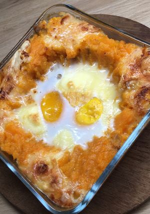 Une photo de Oeufs cocotte à la patate douce et au Langre