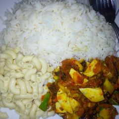 A picture of White rice wit dryfish nd cocumber sauce.