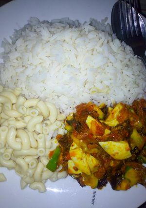 A picture of White rice wit dryfish nd cocumber sauce.