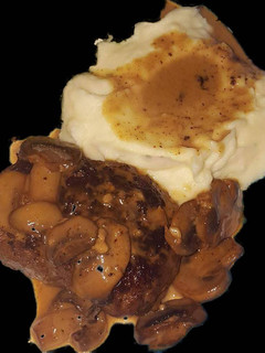 A picture of Salisbury Steak with Mushroom Marsala Sauce.