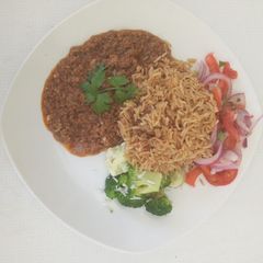 Pilau, served with minced meat and Kachumbari A picture of Pilau, served with minced meat and Kachumbari.