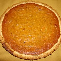 A picture of Pumpkin Pie with ricotta cheese, coconut, almonds.