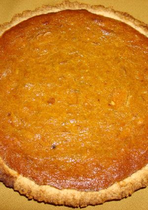 A picture of Pumpkin Pie with ricotta cheese, coconut, almonds.