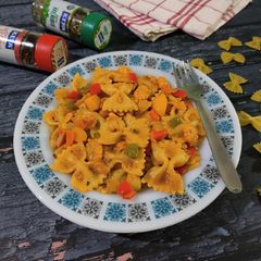 A picture of Farfalle pasta in pink sauce / Creamy masala farfalle pasta.