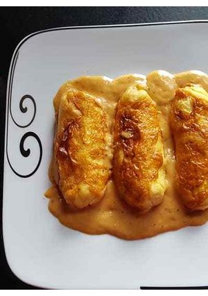 Une photo de Quenelles semoule sauce homardine