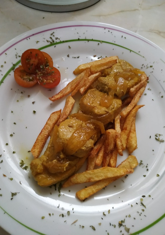 Una foto de Solomillo encebollado