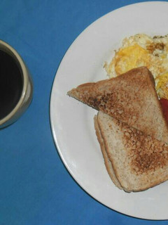 A picture of Eggs and tomatoes.