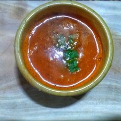 A picture of Pure vegetarian tomato carrot soup.