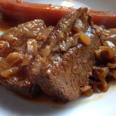 A picture of Slow Cooked Beef Brisket with Onions.