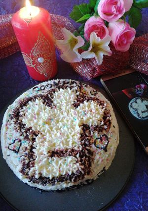 A picture of Chocolate cake with chef's hat.