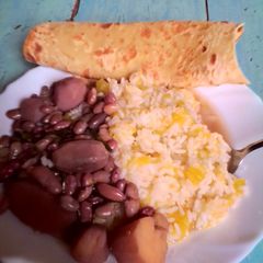 A picture of Rice,viazi,beans and chapati.