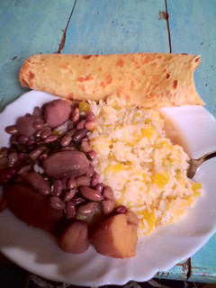 A picture of Rice,viazi,beans and chapati.