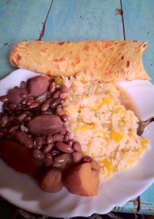 A picture of Rice,viazi,beans and chapati.
