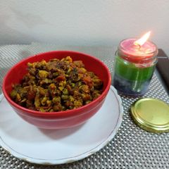 A picture of Cauliflower with green peas and carrot potato.