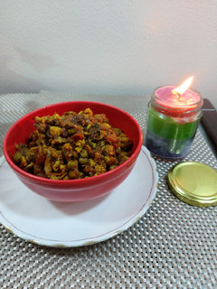 A picture of Cauliflower with green peas and carrot potato.
