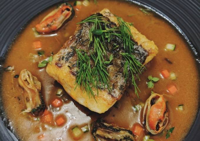 Seabass served with mussels in tomato sauce