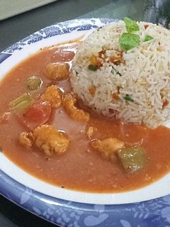 A picture of Chicken shashlik with fried rice.