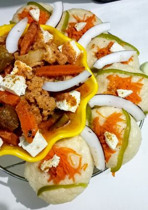 A picture of Coconut Navratan Korma with vegetable Idlis.