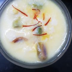 A picture of Mom's sweetest surprise- Rasgulla payesh (Rasgulla kheer).