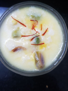 A picture of Mom's sweetest surprise- Rasgulla payesh (Rasgulla kheer).