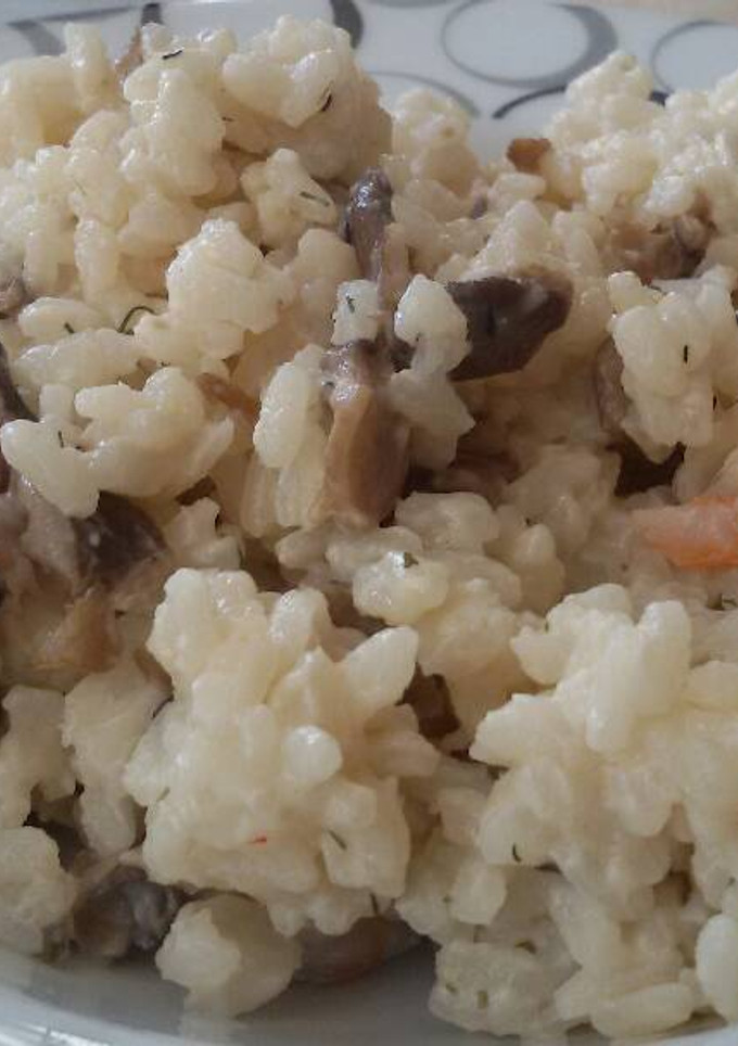 Una foto de Arroz cremoso con setas y gambas
