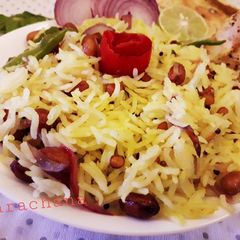 A picture of Lemon rice with mix salad.