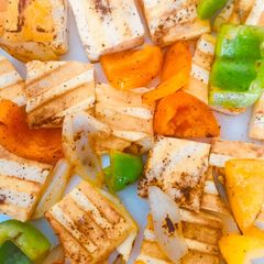 A picture of Grilled tofu with veggies.