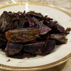 A picture of Rosemary Roasted Purple Potatoes.