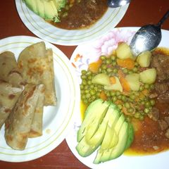 Chapati and peas stew with fried meat plus ovacado A picture of Chapati and peas stew with fried meat plus ovacado.