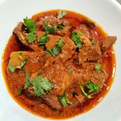 A picture of Onion Tomato Chicken.
