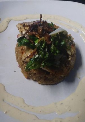 A picture of Crab Cake Caramelized onions Sauted Swiss Chard and Dill Cream.