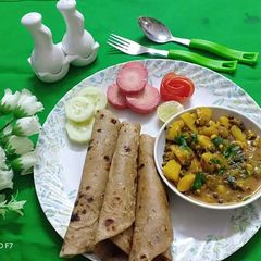 A picture of Sprout aaloo ki sabji with ghee ke parathe.