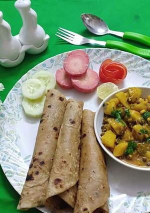 A picture of Sprout aaloo ki sabji with ghee ke parathe.