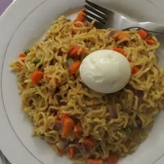 Indomine and egg with carrots and green peas A picture of Indomine and egg with carrots and green peas.