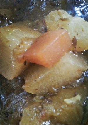 A picture of Khatta meetha Kaddu with cocktail fruit.