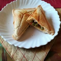A picture of Sandwich with leftover peas filling.