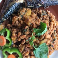 A picture of Beans and plantain porridge with sent leaf.