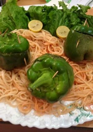 A picture of Stuffed capsicum with noodles.