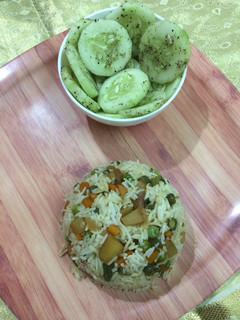 A picture of Veggie rice with pepper cucumber.