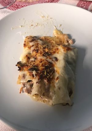 Una foto de Canelones de blanco y negro con cuatros quesos