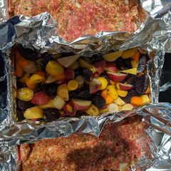A picture of Meatloaf with Carrots and Potato's.