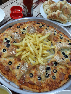 صورة لوصفة بيتزا على شكل وردة