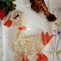 A picture of Spicy chicken drumstick with zeera rice.