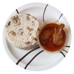 A picture of Rice and Beans with Chicken Stew.