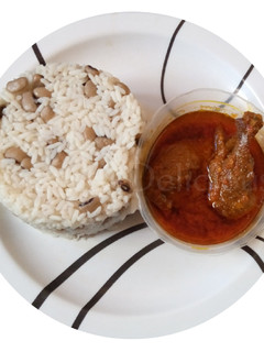 A picture of Rice and Beans with Chicken Stew.