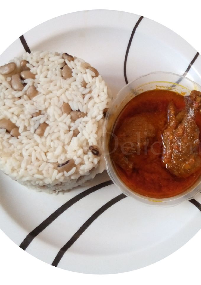 A picture of Rice and Beans with Chicken Stew.